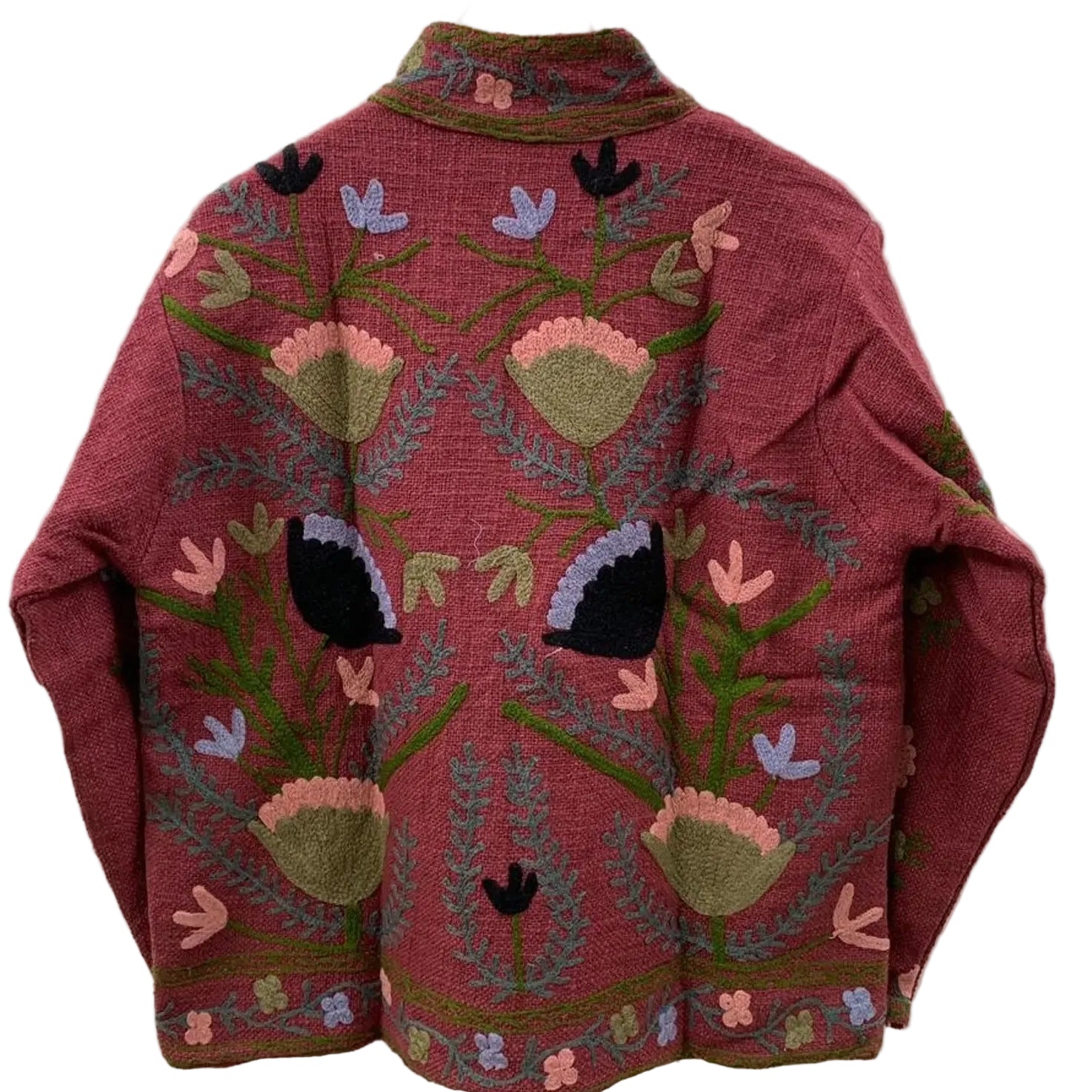 Back view of a handmade maroon textured cotton TNT short jacket featuring intricate Suzani embroidery with olive green vines, pink floral fans, and black botanical accents, hanging on a wooden hanger against a white wall.