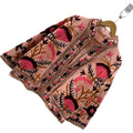 Front view of an open-style handmade peach pink textured cotton TNT short jacket featuring bright pink and dark maroon Suzani fan-floral embroidery with brown branches.