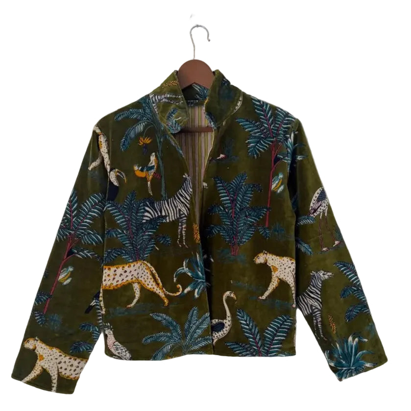 Back view of a dark green velvet TNT jacket featuring a colorful tropical safari print with cheetahs, zebras, exotic birds, and palm leaves.