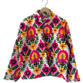 Front view of an open-style handmade white textured cotton TNT short jacket featuring a dense, all-over pattern of bright hot pink, yellow, and green Suzani floral embroidery.